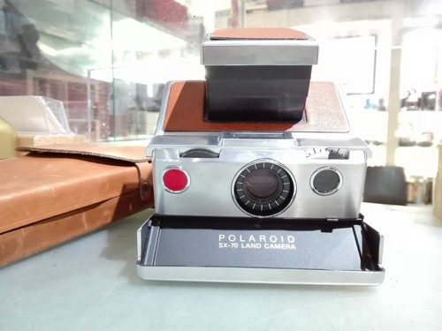 Polaroid sx70 con - [nc],
